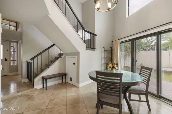 a dining room with furniture and wooden floor