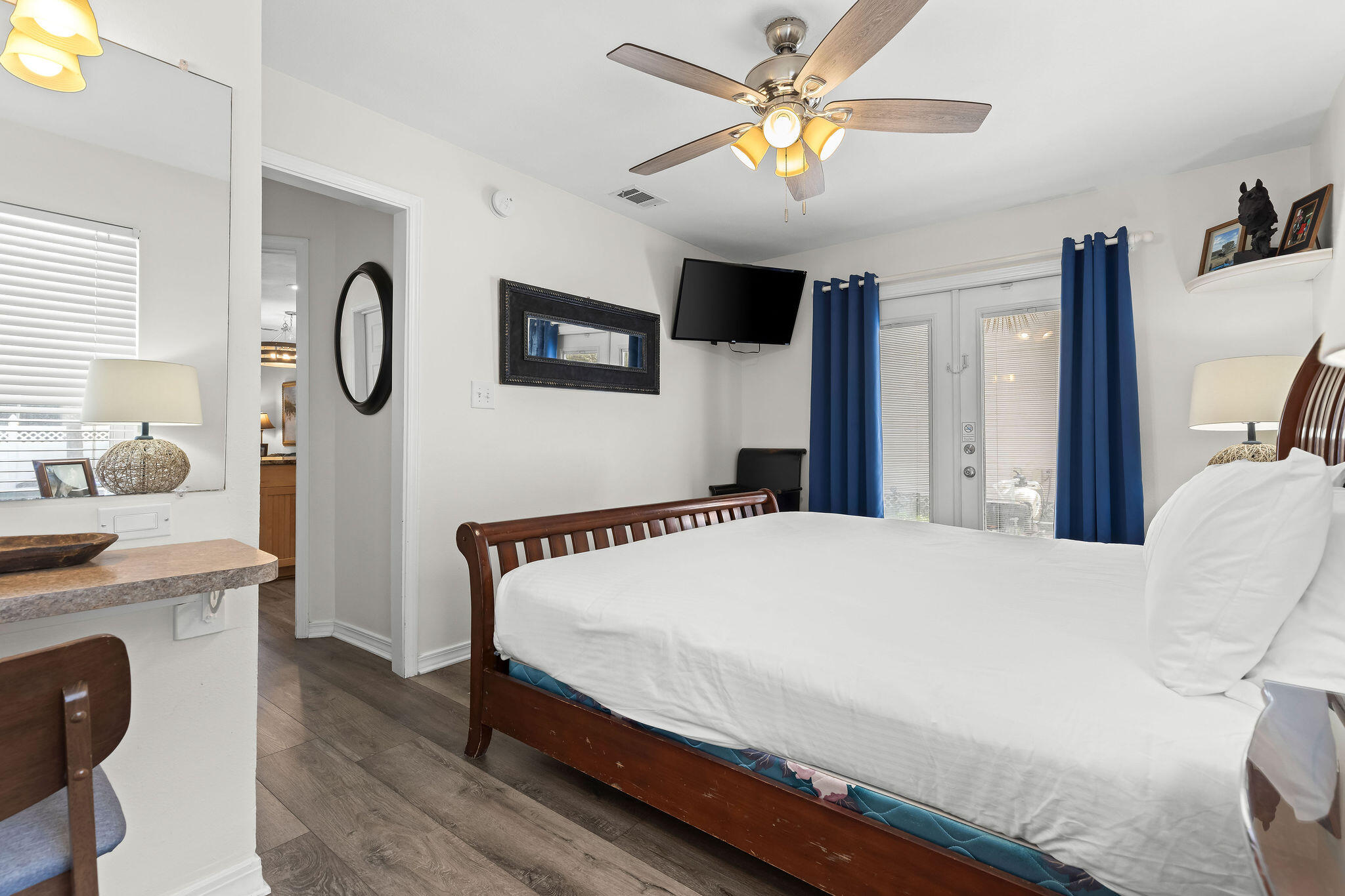 91 Matthew Boulevard Destin, FL 32541 - Photo 37 of 85 a bedroom with a bed a chandelier and a window