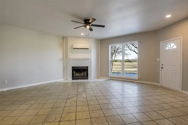 a kitchen with stainless steel appliances granite countertop a stove a sink a microwave and a refrigerator