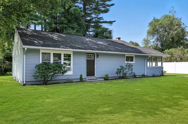 a house that has a big yard in front of it
