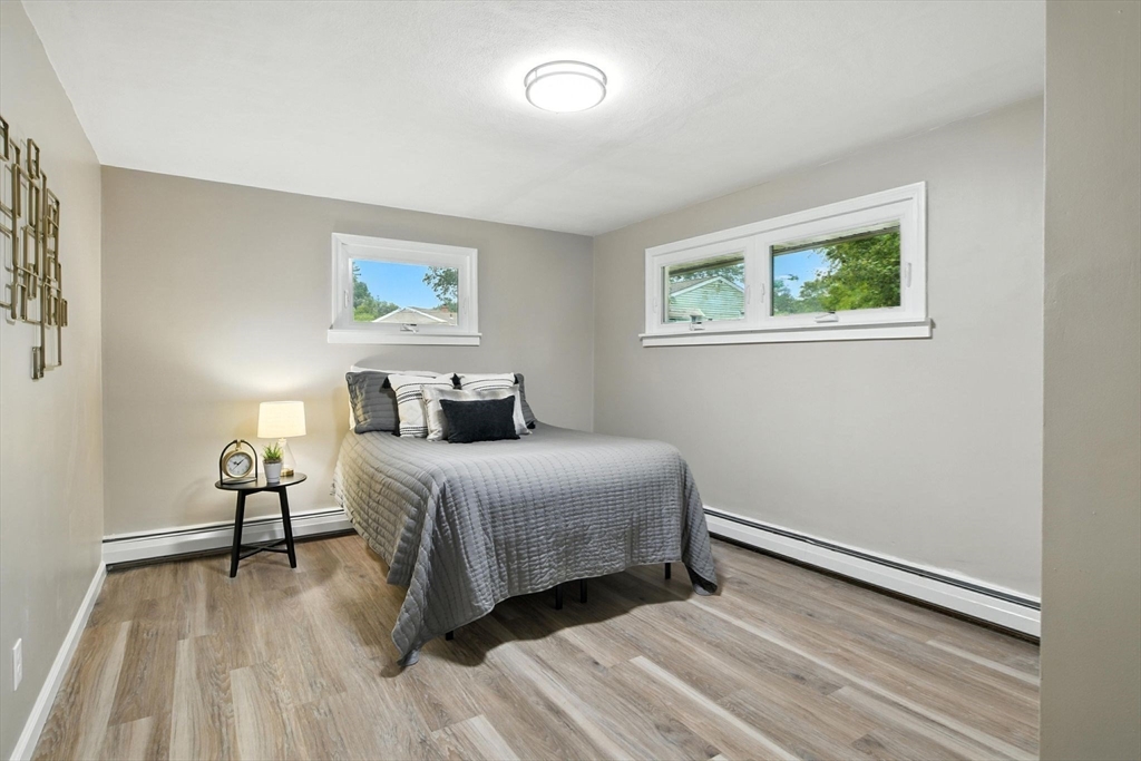 17 Pebble Mill Road Springfield, MA 01118 - Photo 17 of 30 a bedroom with a bed and a painting on the wall