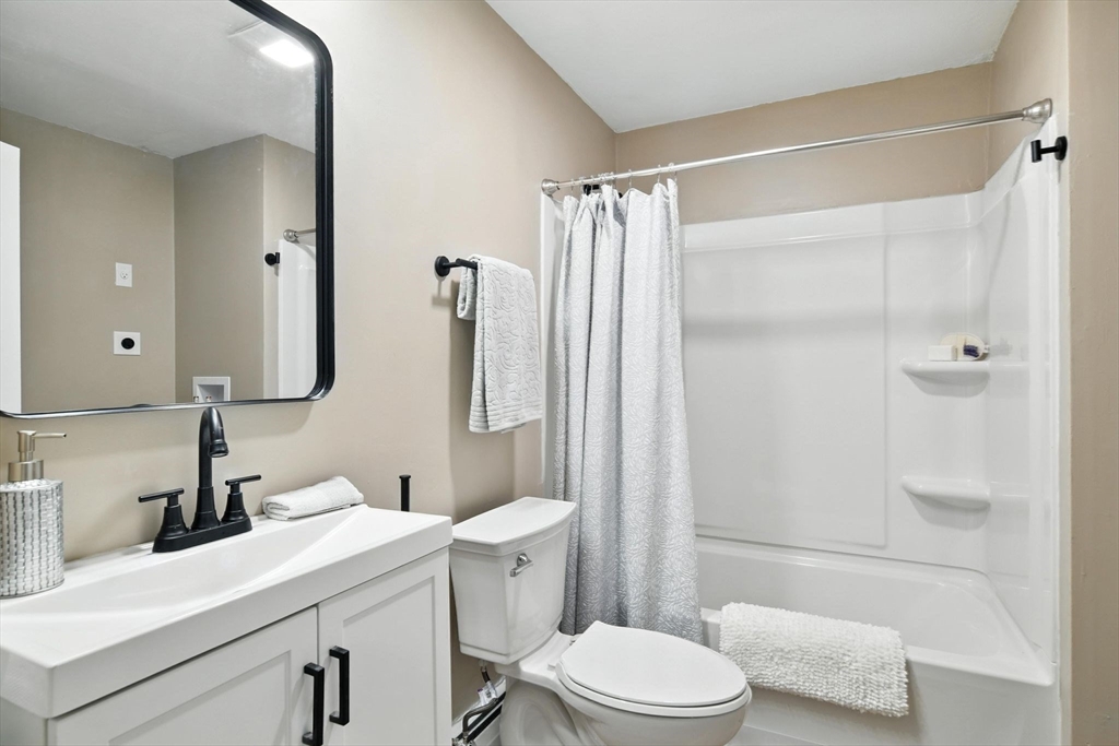 17 Pebble Mill Road Springfield, MA 01118 - Photo 20 of 30 a bathroom with a sink a toilet and shower