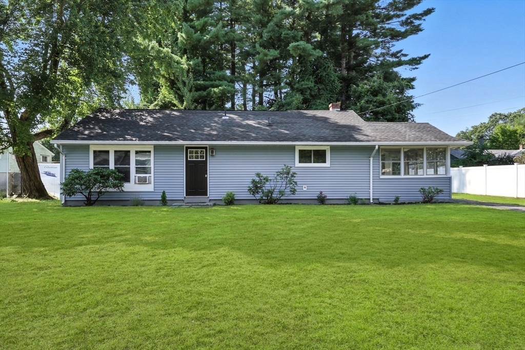17 Pebble Mill Road Springfield, MA 01118 - Photo 2 of 30 a front view of a house with a garden