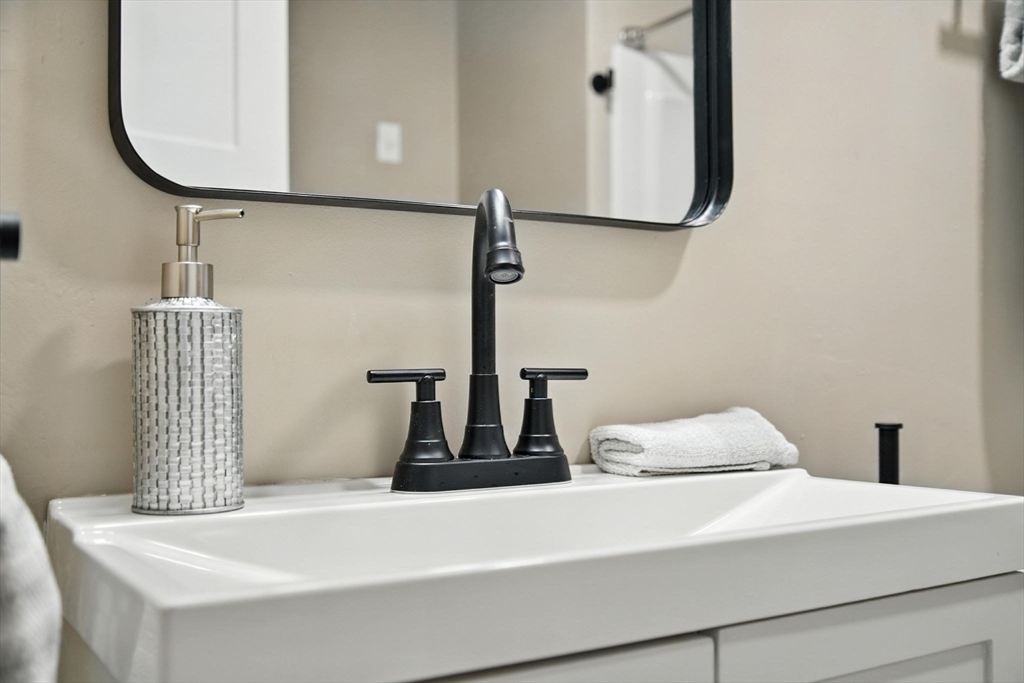 17 Pebble Mill Road Springfield, MA 01118 - Photo 21 of 30 a bathroom with a sink and a mirror