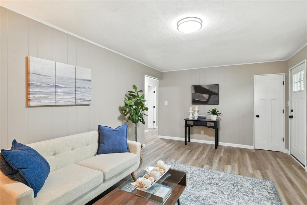 17 Pebble Mill Road Springfield, MA 01118 - Photo 3 of 30 a living room with furniture and a wooden floor