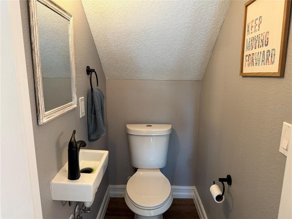 10056 Gifford Drive Spring Hill, FL 34608 - Photo 13 of 27 a bathroom with a toilet and a sink