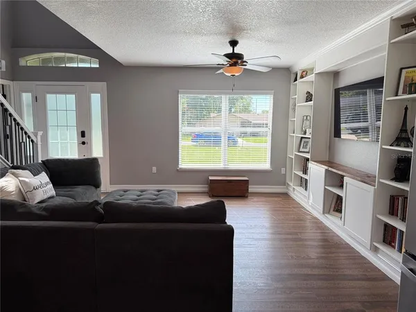 a living room with furniture and a window