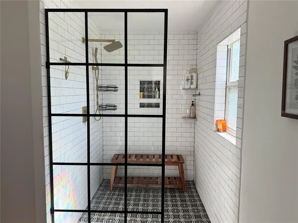 a bathroom with a granite countertop sink a toilet and mirror