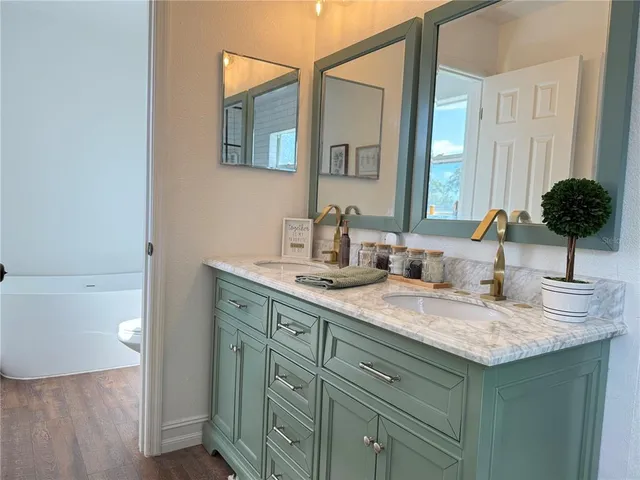 a white bath tub sitting in a bathroom