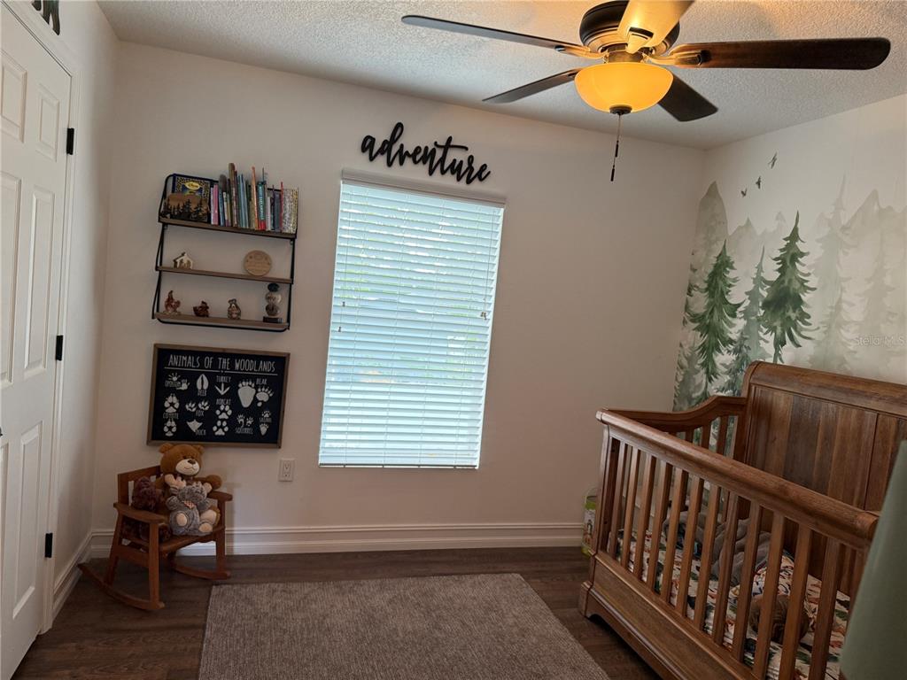 10056 Gifford Drive Spring Hill, FL 34608 - Photo 23 of 27 a bedroom with furniture and a window
