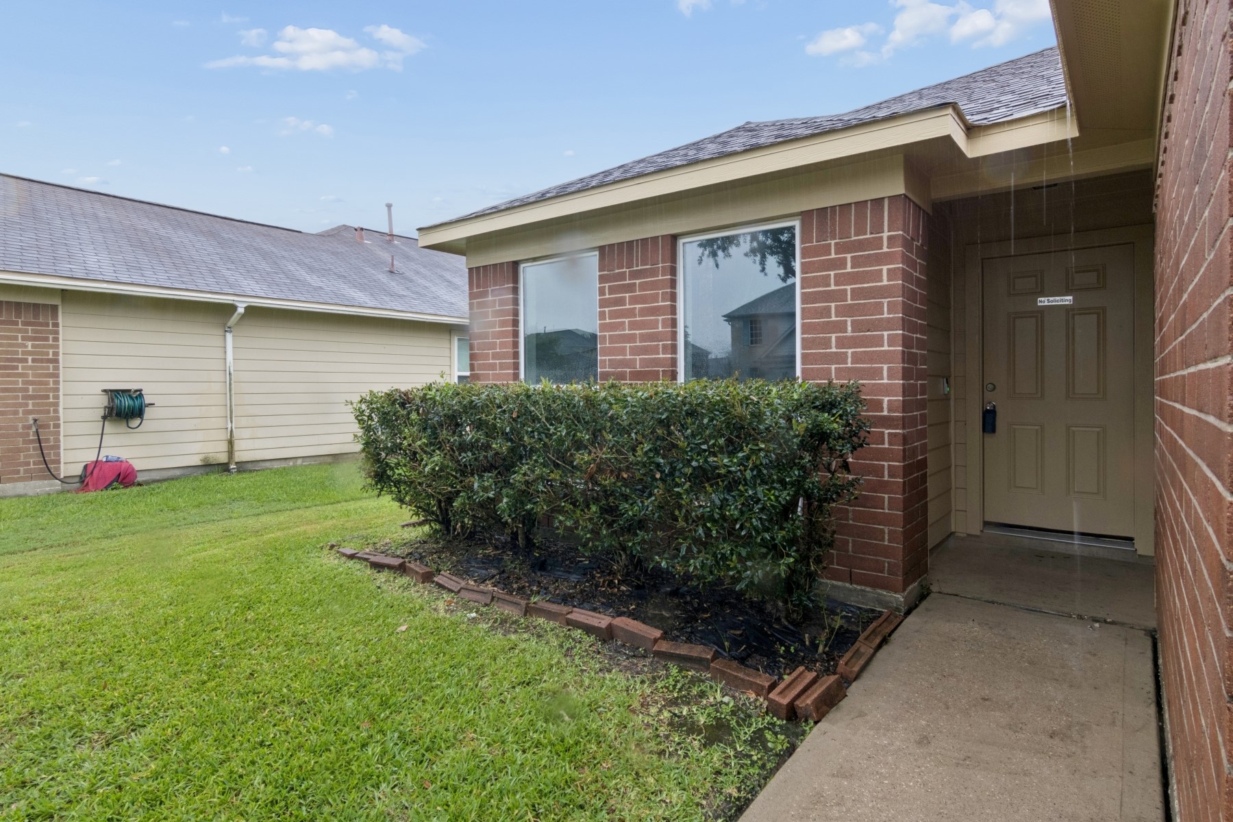 7811 Adonis Avenue Baytown, TX 77521 - Photo 6 of 36 a front view of a house with a yard