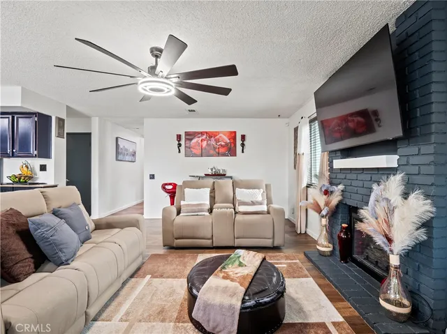 a living room with furniture and a fireplace