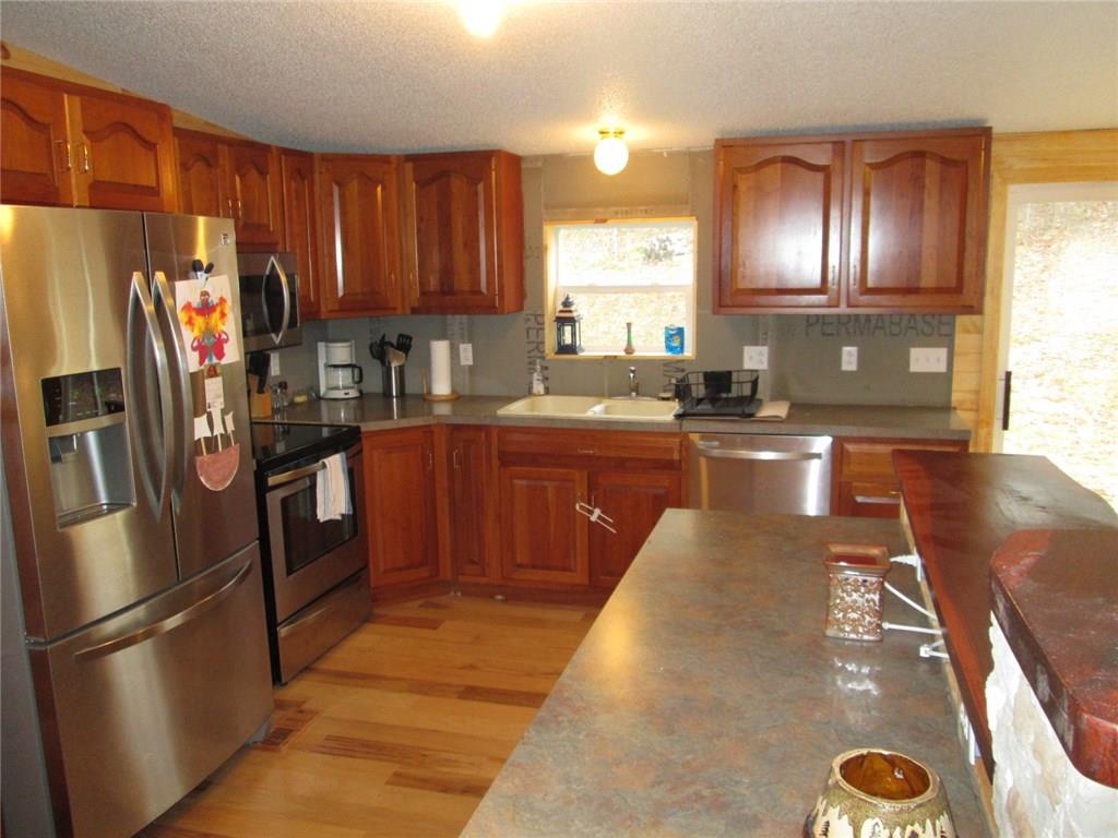 103 State Rte 1041 Dayton, PA 16222 - Photo 3 of 16 Beautiful high end cherry kitchen!! Notice the included stainless steel appliances!! Hickory floors, Walnut breakfast bar to the right!!