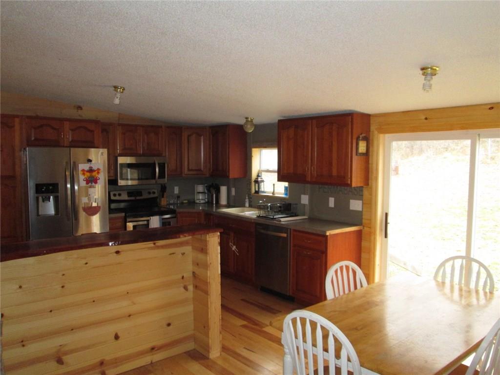 103 State Rte 1041 Dayton, PA 16222 - Photo 5 of 16 A view from the living room showing the open floor plan, Dining room with sliding door and once again the amazing kitchen!!