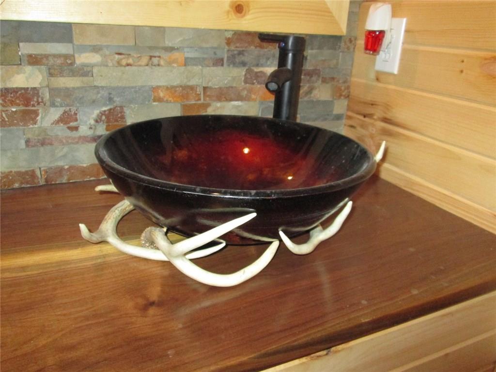 103 State Rte 1041 Dayton, PA 16222 - Photo 8 of 16 Lower level bathroom sink, amazing!! With the sink and stonework next to the knotty pine!!