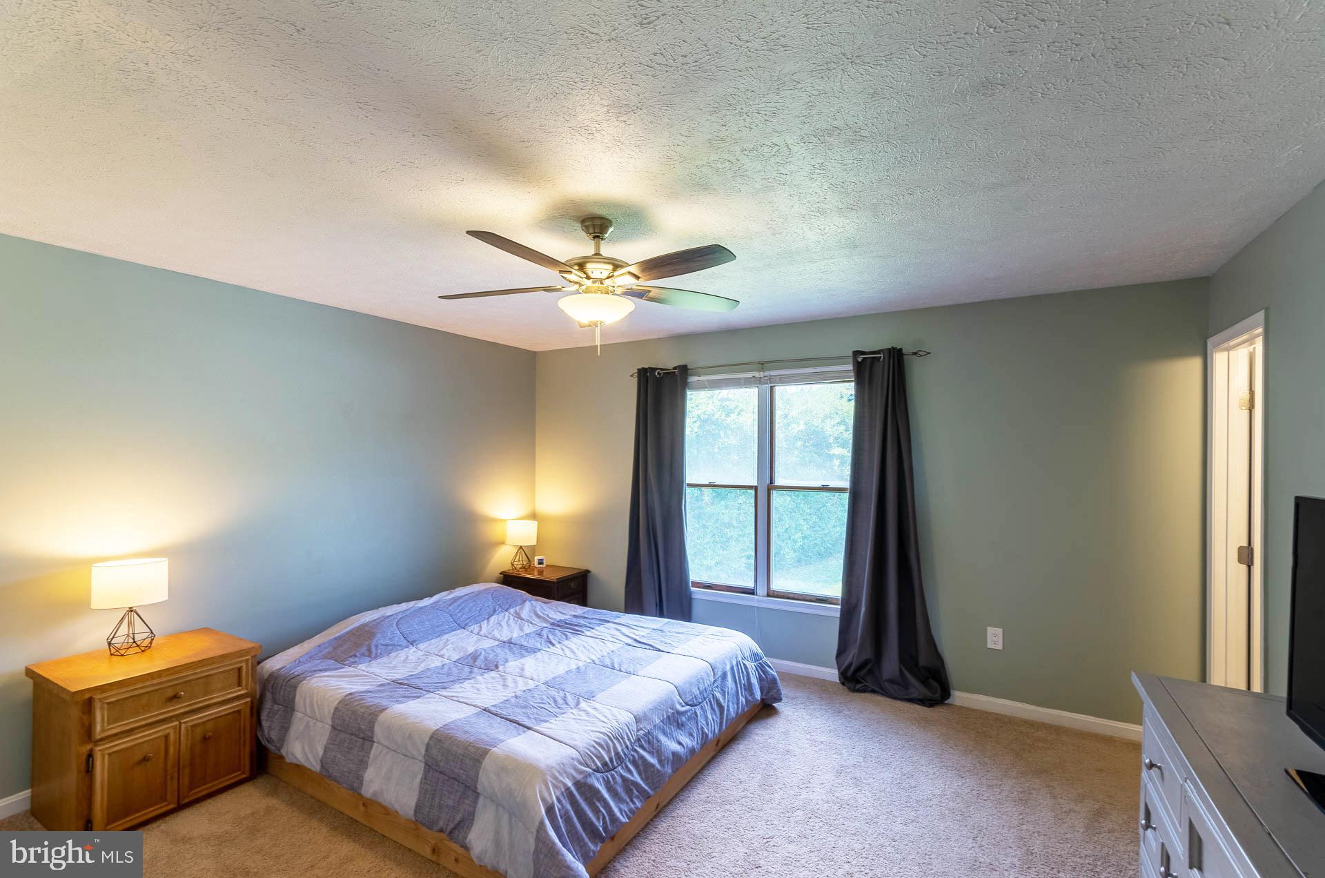 26 Liddell Road Colora, MD 21917 - Photo 18 of 37 a bedroom with a bed and a window