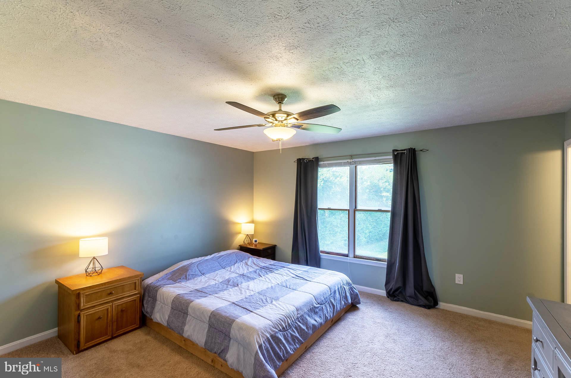 26 Liddell Road Colora, MD 21917 - Photo 20 of 37 a spacious bedroom with a bed and a window