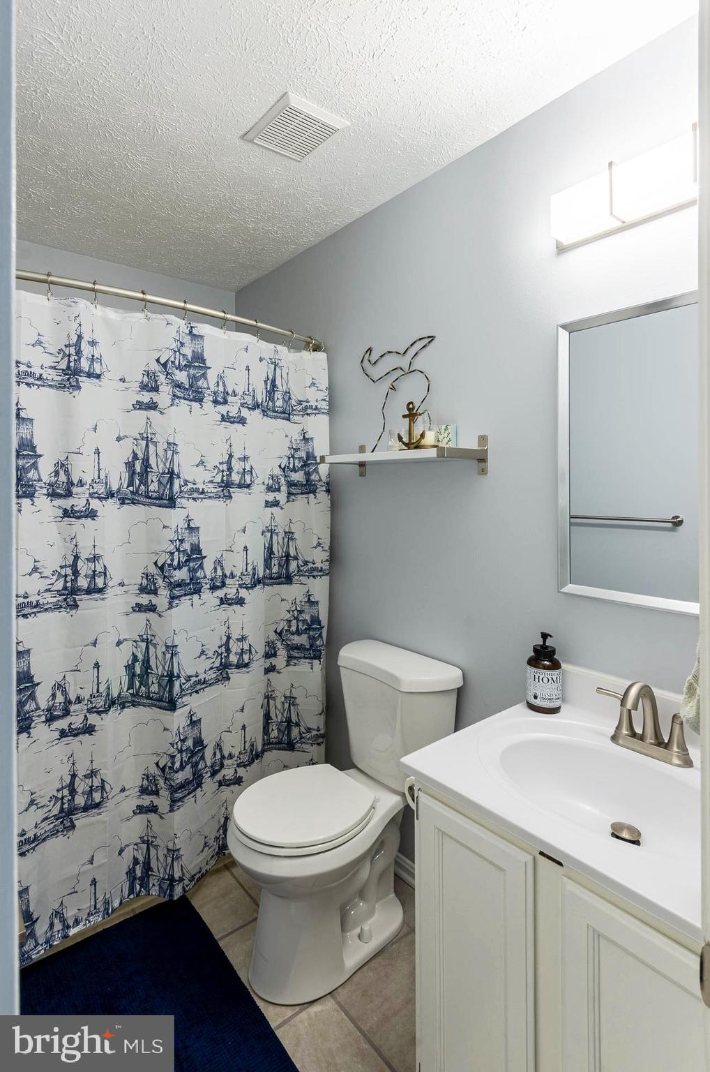 26 Liddell Road Colora, MD 21917 - Photo 21 of 37 a bathroom with a toilet sink and shower