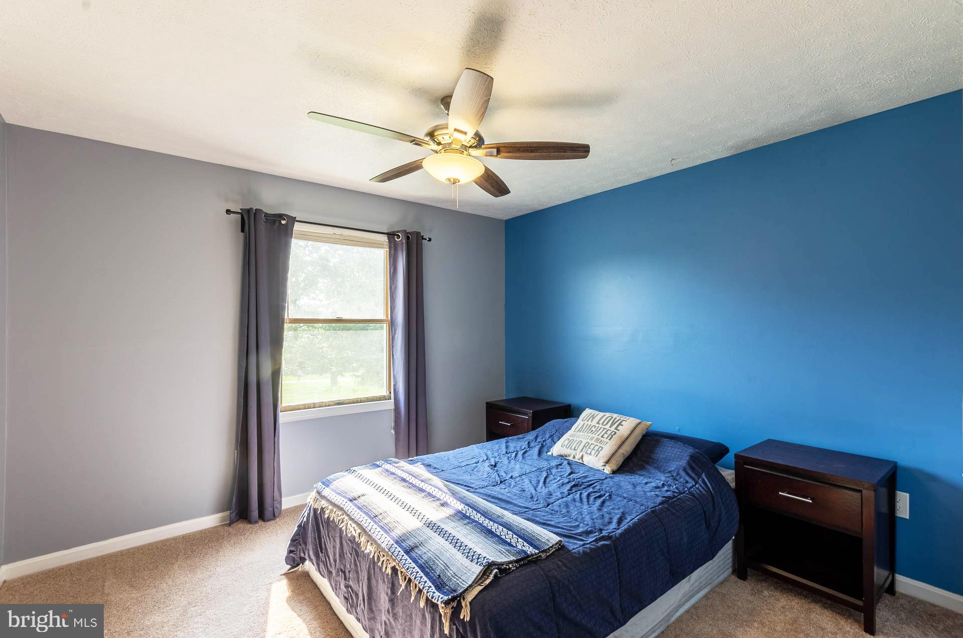 26 Liddell Road Colora, MD 21917 - Photo 26 of 37 a bedroom with a bed and a chandelier