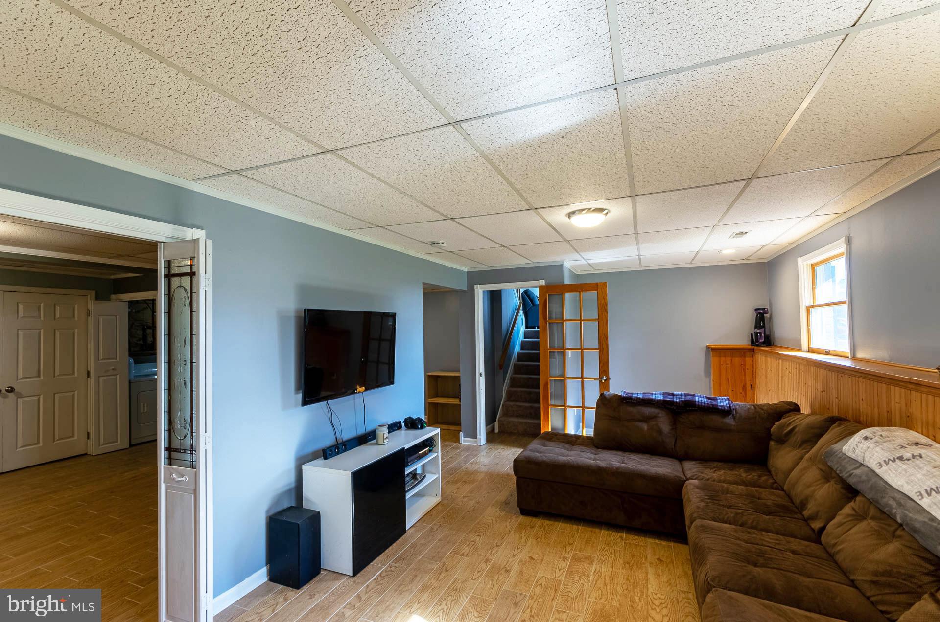 26 Liddell Road Colora, MD 21917 - Photo 29 of 37 a living room with furniture and a flat screen tv