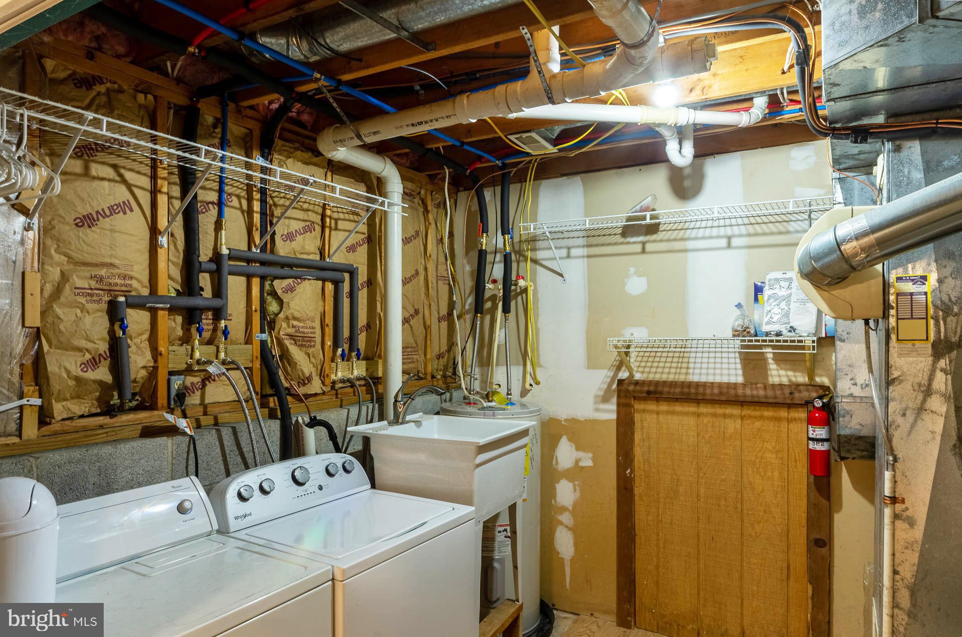 26 Liddell Road Colora, MD 21917 - Photo 32 of 37 a utility room with multiple dryer and washer