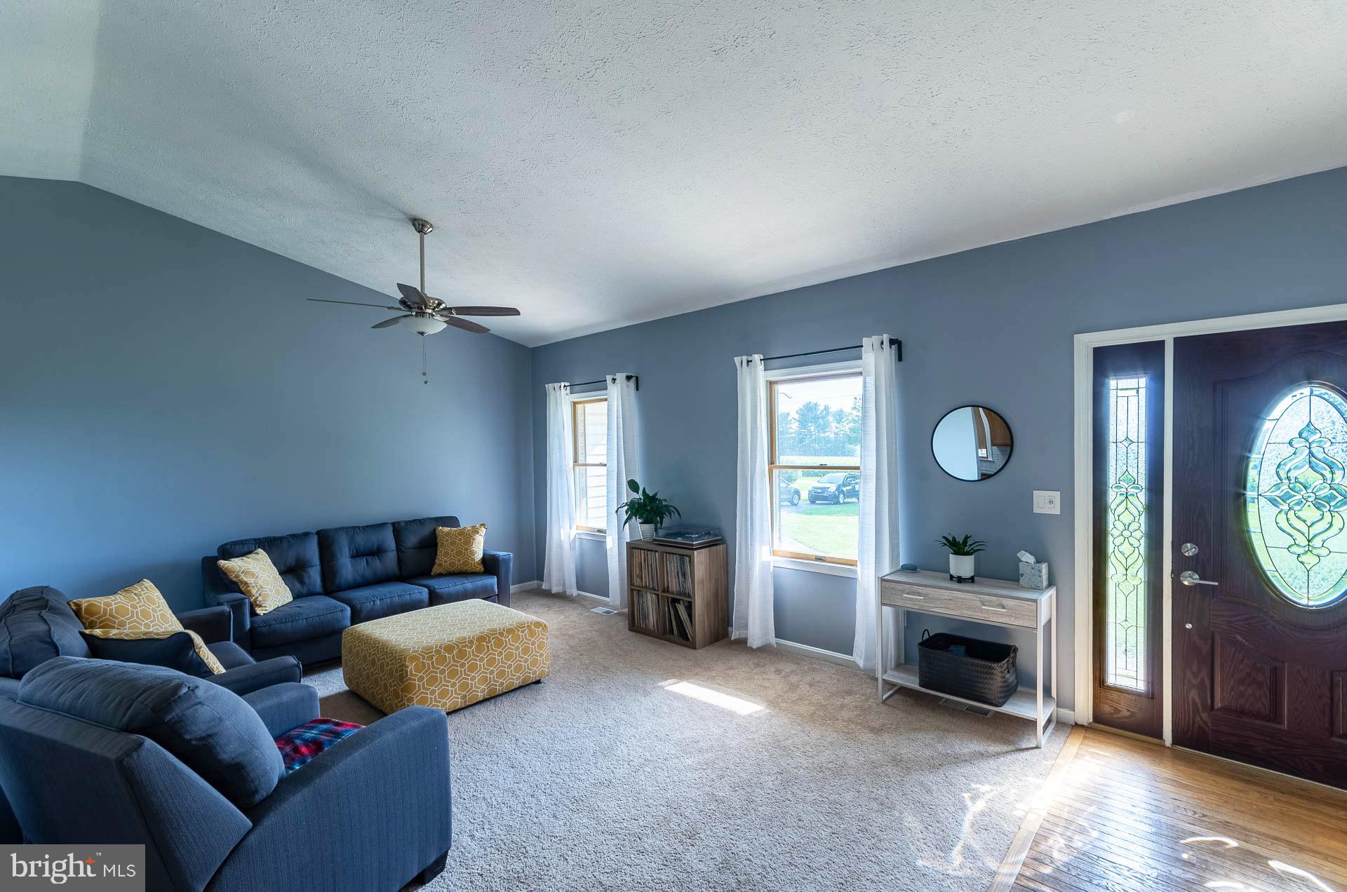 26 Liddell Road Colora, MD 21917 - Photo 5 of 37 a living room with furniture a window and a clock