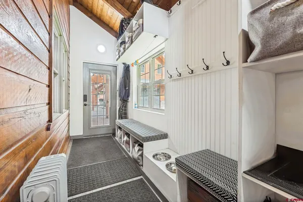 a view of an entryway with wooden floor