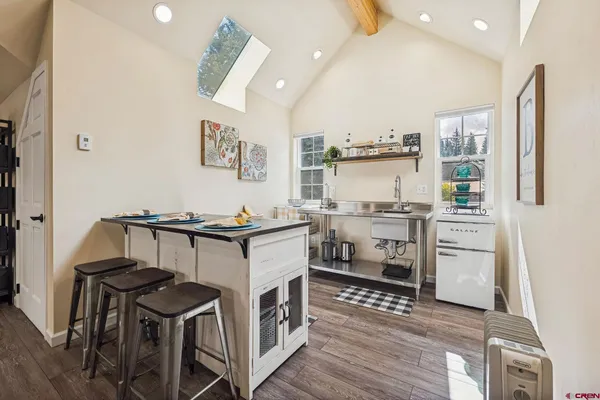 a kitchen with stainless steel appliances granite countertop a stove and a refrigerator