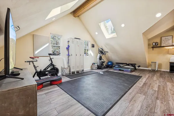 a room with gym equipment and a mirror