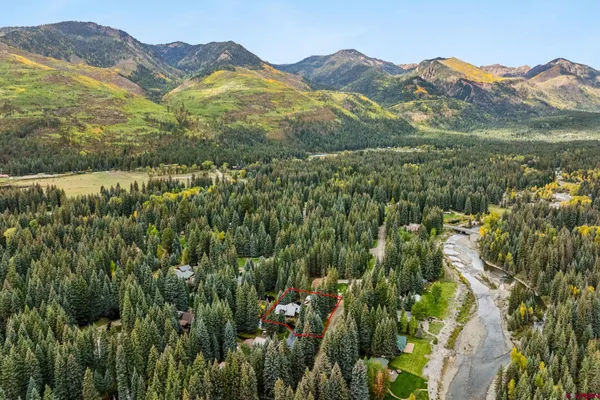 a view of a town with mountains in the background