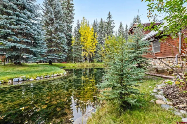 a view of a lake with a building in the background