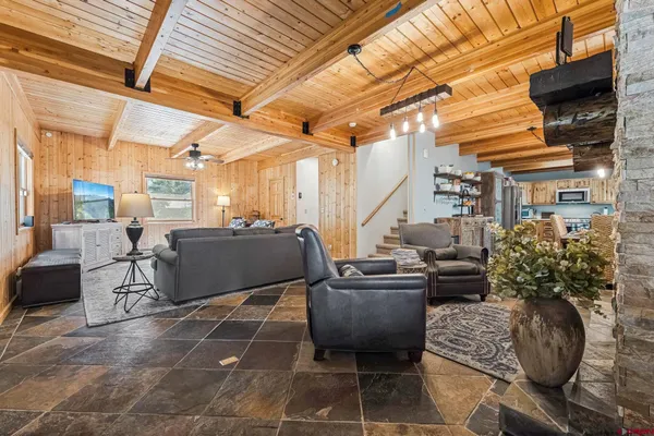 a building outdoor space with patio furniture and potted plants