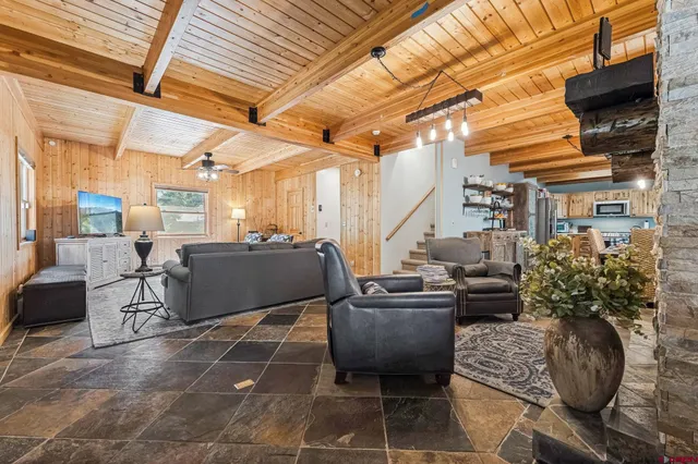 a building outdoor space with patio furniture and potted plants