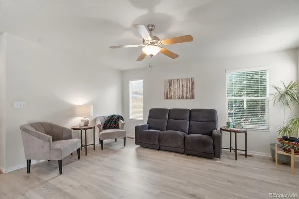 a living room with furniture and a large window