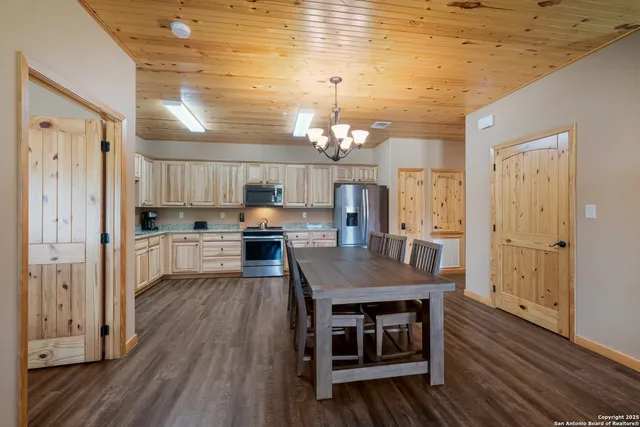 a open kitchen with a table and chairs in it