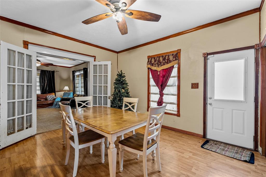 306 South Cleveland Meridian, TX 76665 - Photo 14 of 26 a view of a dining room with furniture window and wooden floor