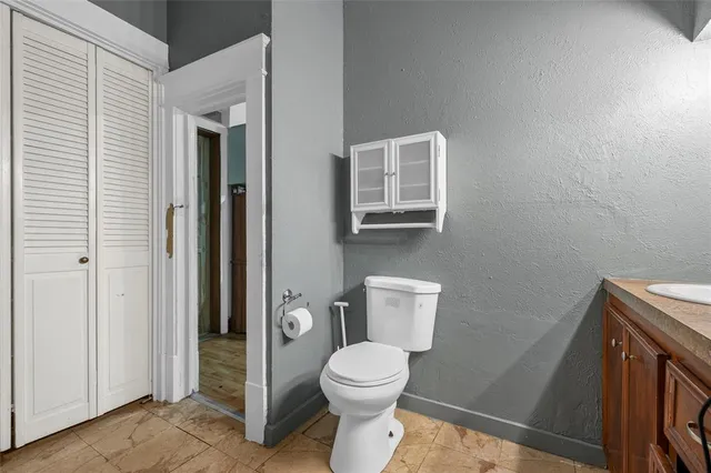 a bathroom with a toilet and a sink