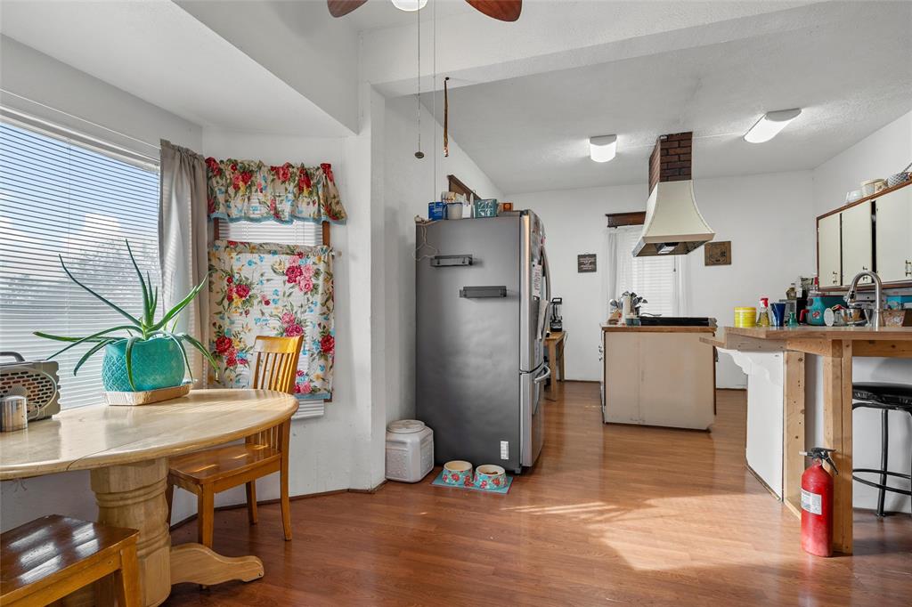 306 South Cleveland Meridian, TX 76665 - Photo 6 of 26 a kitchen with refrigerator and window