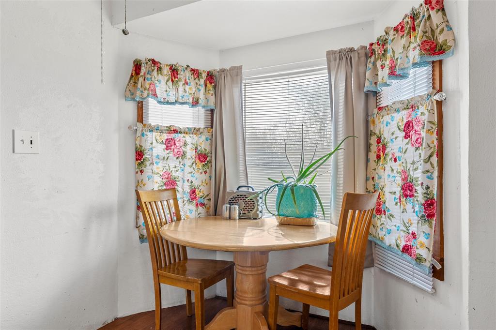 306 South Cleveland Meridian, TX 76665 - Photo 10 of 26 a view of a dining room with furniture and wooden floor