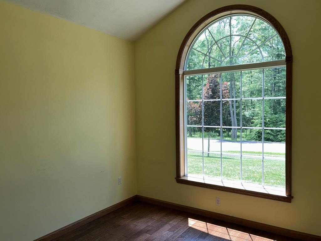 114 Oak Ridge Drive Clarion, PA 16214 - Photo 27 of 38 an empty room with wooden floor and a window