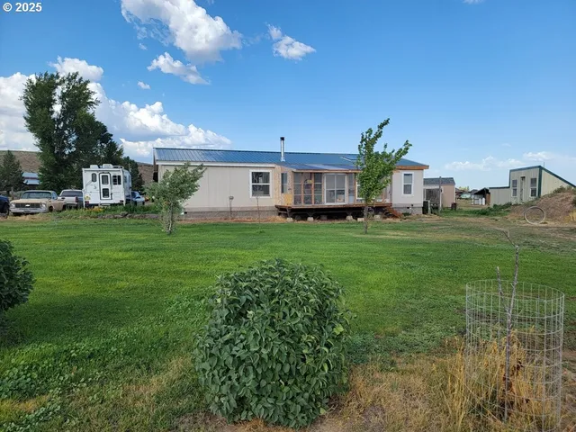 a view of a house with a big yard