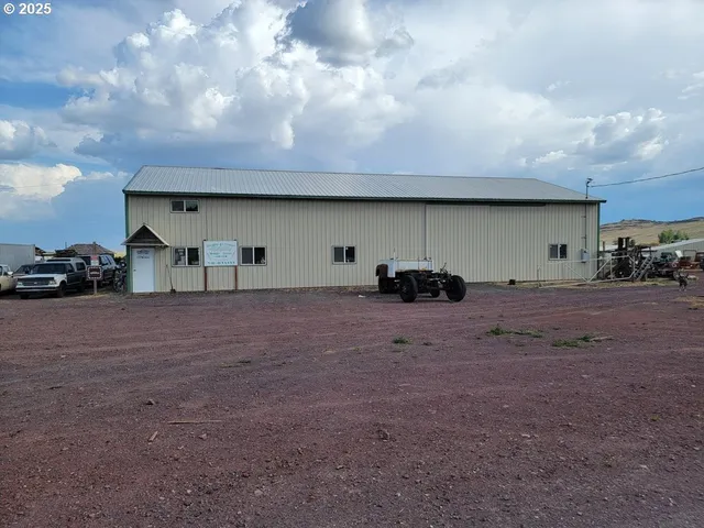 a view of a street with a car parked in front of it