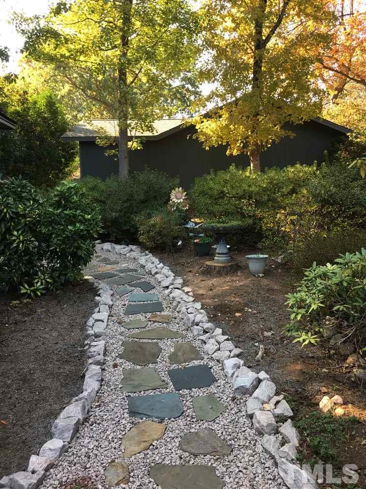 2850 Rue Sans Famille Raleigh, NC 27607 - Photo 20 of 24 a view of a pathway both side of yard