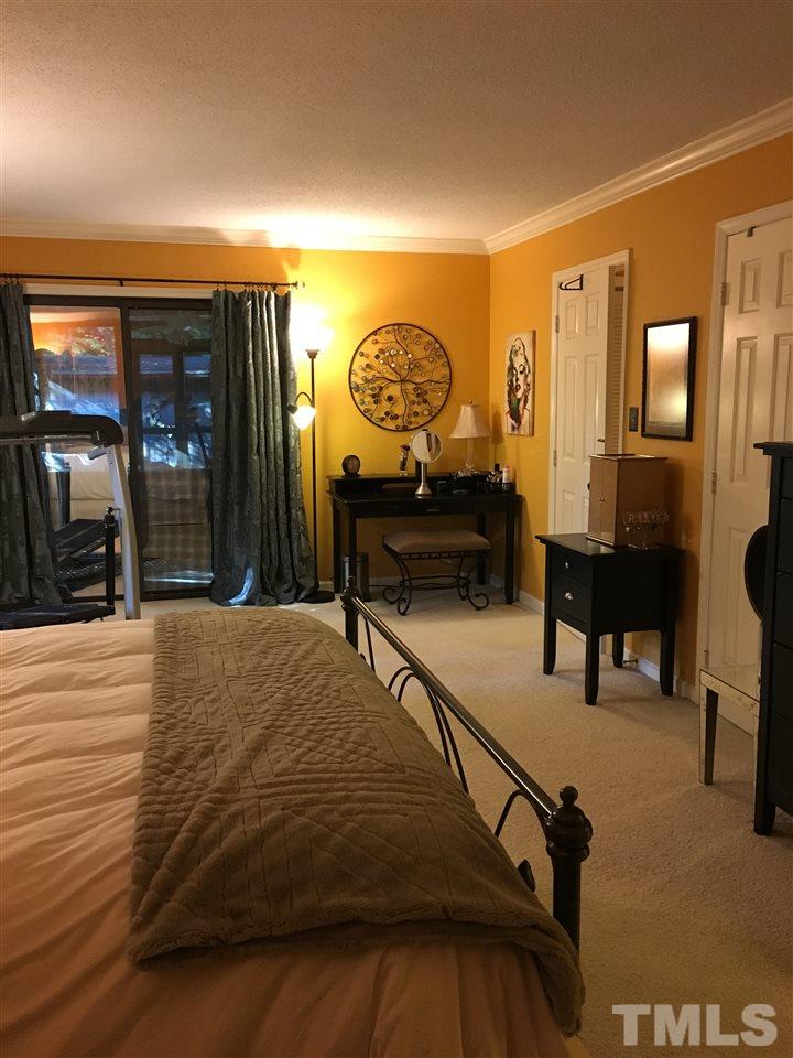 2850 Rue Sans Famille Raleigh, NC 27607 - Photo 22 of 24 a bedroom with furniture and a window