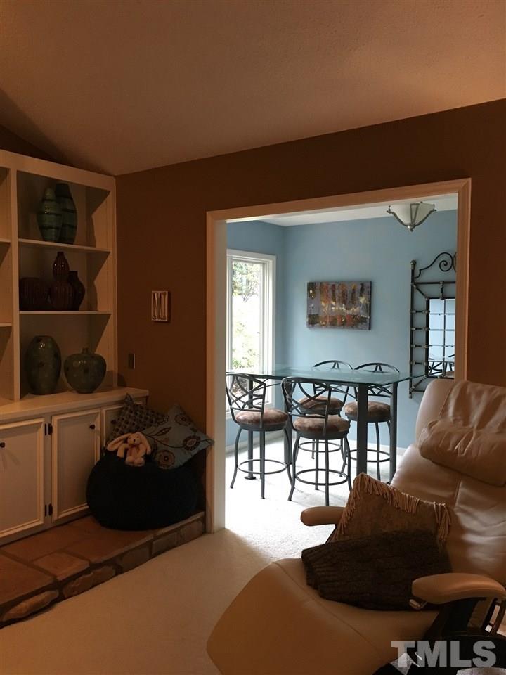 2850 Rue Sans Famille Raleigh, NC 27607 - Photo 4 of 24 a living room with furniture and a window