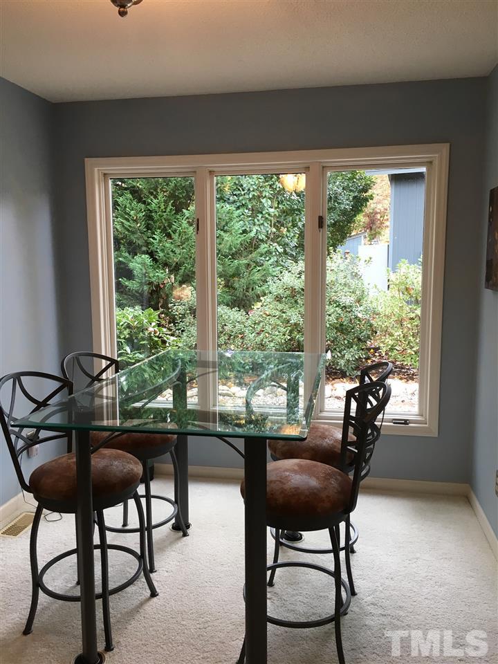 2850 Rue Sans Famille Raleigh, NC 27607 - Photo 7 of 24 a living room with furniture and a window