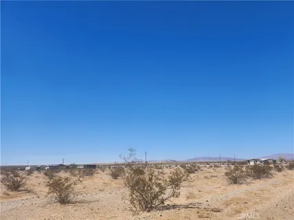 a view of a large mountain range and snow