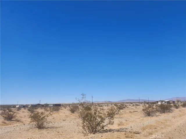 a view of a large mountain range and snow