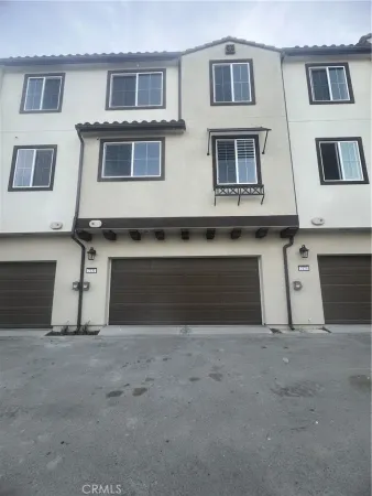 a front view of a house with a garage