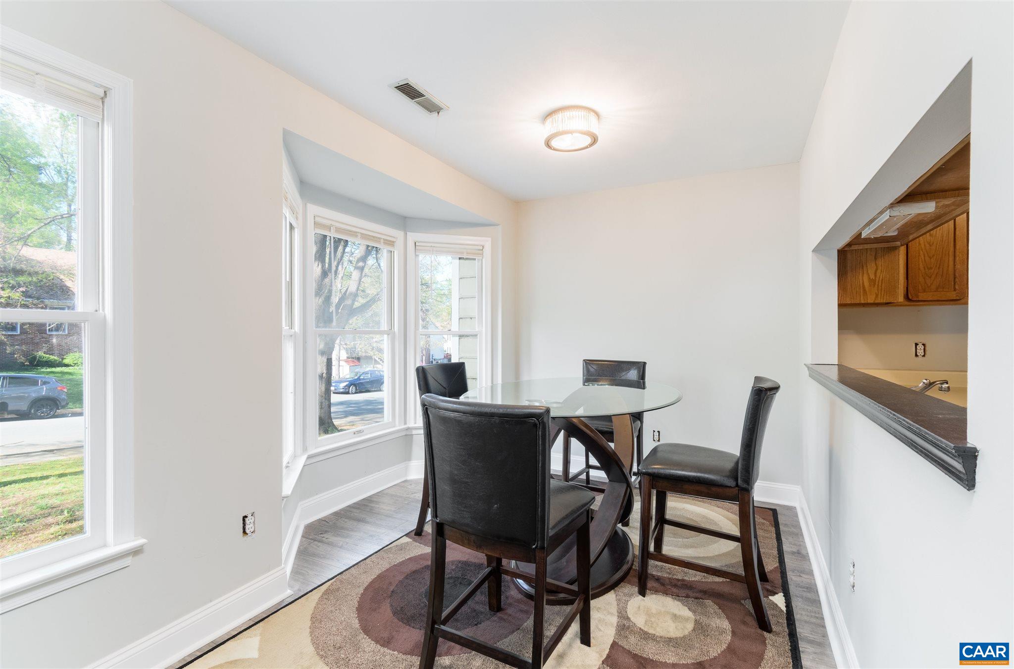 342 Westfield Road Charlottesville, VA 22901 - Photo 12 of 23 a view of a dining room with furniture window and outside view